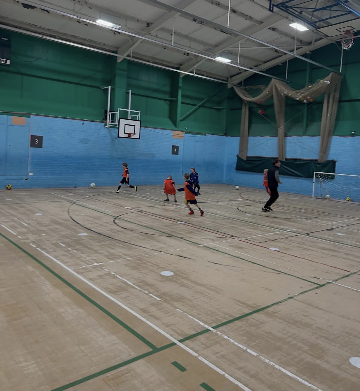 Indoor small group football coaching